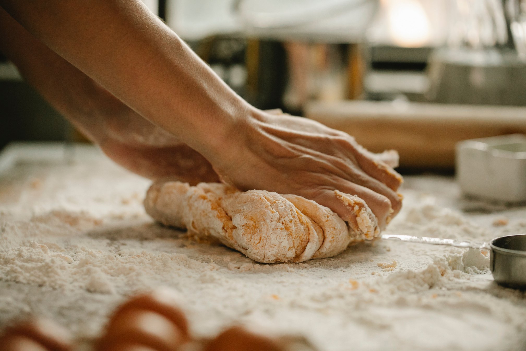 Chef preparing dough for baking in cafe